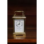 A Matthew Norman of London brass carriage clock, white enamelled dial and black Roman numerals,