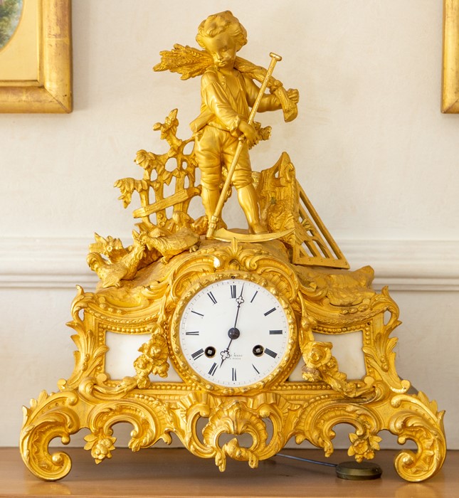 A French ormolu rococo revival mantel clock by Henri Marc,