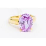 A yellow gold and pink stone ring, stamped 750, size K1/2, gross weight approx 6.3gms Condition