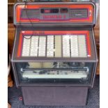 Wurlitzer: A Wurlitzer SL600 Jukebox, non-working order: lights up but record do not play, mid-