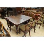 A Victorian mahogany extending dining table, fitted with two removable leaves, raised on turned