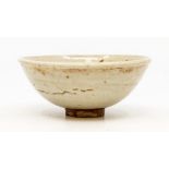 A Chinese white glaze footed bowl, raised on a terracotta base, early probably pre 18th Century