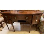 A George III mahogany sideboard, in the manner of George Hepplewhite, raised on square tapered legs,