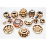 A collection of Royal Crown Derby 1128 pattern, old and new Imari, to include salt and peppers,