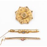 A collection of three brooches to include a 9ct gold  Victorian three colour gold floral inlaid