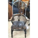 A stained beech Windsor-type high back armchair, 20th Century, the typical hooped back with three