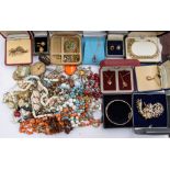 A collection of assorted costume jewellery, various gilt metal rings. chains, necklaces, some