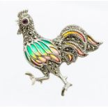 A plique a jour silver and enamel brooch in the form of a cockerel, ruby set eye and marcasite