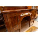 An Edwardian mahogany sideboard, central drawer and two cupboard doors, tapered supports, 77cm high,