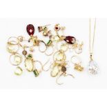 A collection of 9ct gold and gemstone earrings to include cut garnets, lema quartz, green diopside