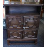 An early 20th Century oak hall cupboard, in the Carolean style, open shelf section to top, fitted