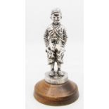 After Felix Pardo de Tavera, a silvered bronze figure of a boy entitled C'est Mi and engraved '