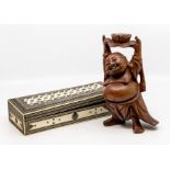 An Indian sadeliwork box and a Chinese carved root wood figure of Buddha