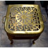 An early 19th Century brass wrought iron trivet pierced top plate, 35 cms high approx