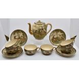 A Japanese hand painted part tea set, probably Meiji period, to include a teapot, two handled lidded