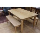 A contemporary beech dining table, rectangular form, raised on turned tapered legs, 73 cms high, 150
