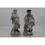 Two Derby figures, the lady with a fishing net representing water and the boy representing Earth,
