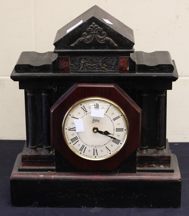 A large French black slate 19th Century mantel clock with black and gilt face classical figures