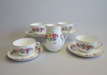 Four Wedgwood Bone China Breakfast Cups and Saucers along with a Milk Jug  decorated with floral