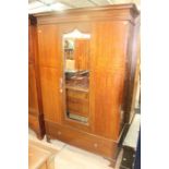 An Edwardian mahogany inlaid wardrobe, complete with a matching dressing chest, (2)