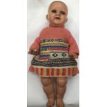 A 20th century bisque head doll, marked to neck '133 3/0', sleep eyes, open mouth, revealing two top