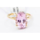 A 14k gold kunzite and diamond ring, the oval-cut stone approx 14mm x 10mm x 7.60mm, ring size S,