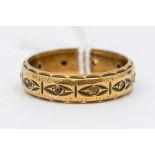 A 9ct gold wedding band, set with white faceted stones, a/f (one missing) Birmingham, 1981, ring
