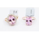 A 10k gold kunzite and zircon cluster ring, the central oval stone approx 14mm x 10mm x 7.68mm, ring