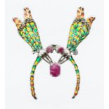 A silver piqué a jour brooch in the form of two damselflies, each with faceted ruby set eyes