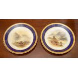 A pair of Royal Worcester cabinet plates by John Stinton, circa 1917, of plain circular form and