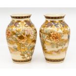 A pair of late 19th Century Japanese Satsuma vases, Meiji Period, hand decorated with flowers,