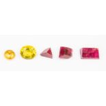 Three rough cut rubies along with an oval yellow/green paste stone approx. 13 x 11mm and a nugget of