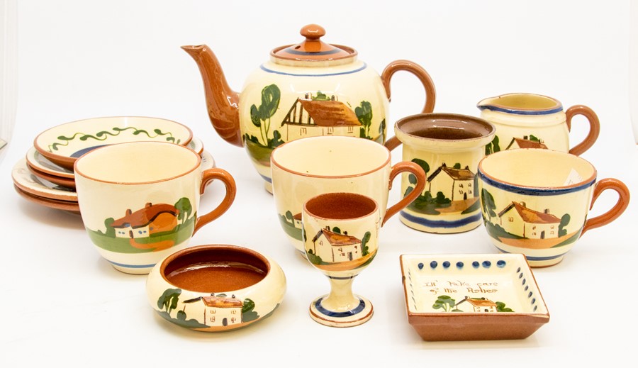 A Torquay ware terracotta part tea set comprising teapot, 3 cups and saucers, side plates, egg