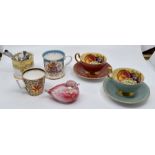 A group of decorative ceramics to include a set of five music boxes, Buckingham Palace mug,