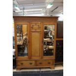 An Edwardian burr maple veneered wardrobe and a matching dressing chest (2)