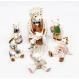 A group of five various Crown Derby figures, including bears, together with a stripy clown and
