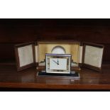 An Art Deco travel clock by Smiths in original fitted leather case