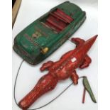 Vintage tinplate Dick Tracy Squad Car made by Marx, 1940’s, 20” long. Playworn with rust. Along with