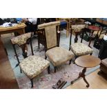 A collection of furniture, comprising a pair of Edwardian mahogany nursing chairs, a Victorian