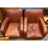 A pair of contemporary brown leather tub chairs, retailed by Habitat, each measuring 83cm high, 66cm