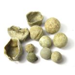 English Civil War Musket Balls and Measures 17th century lead musket balls of various sizes along