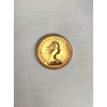 Elizabeth II 1982 full Sovereign. Condition, slight wear to high points with  scratches to