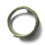 Viking Ring. Circa 10th century AD. 4.34 grams. 19.61 mm, internal 16.29 mm. A Viking bronze coil