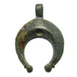 Roman Military Pendant.  Circa 49 -200 AD. Copper-alloy, 7.44 grams. 39.84 mm. A Roman military