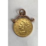 USA 22ct gold 10 dollars 1894 with yellow metal mount. (approx 19g total)   Condition, yellow