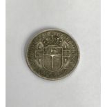 Rhodesia 1947 Half crown, good grade. Condition. Wear to high points with small scratches to