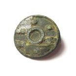 Roman Disk Brooch. Circa 2nd century AD. Copper-alloy, 3.09 grams. 19.66 mm. A Circular disk