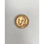 George V 1911 Half Sovereign. Condition wear to high points with small scratches to surface.