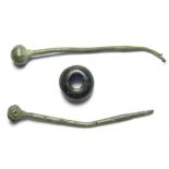 Anglo-Saxon Pins and Bead.  Circa 6th-8th century AD. Copper-alloy pins, 56.77 mm, bead; 12.40 mm. A