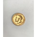 George V 1913 Sovereign. Condition, wear to high points with small scratches to surface.